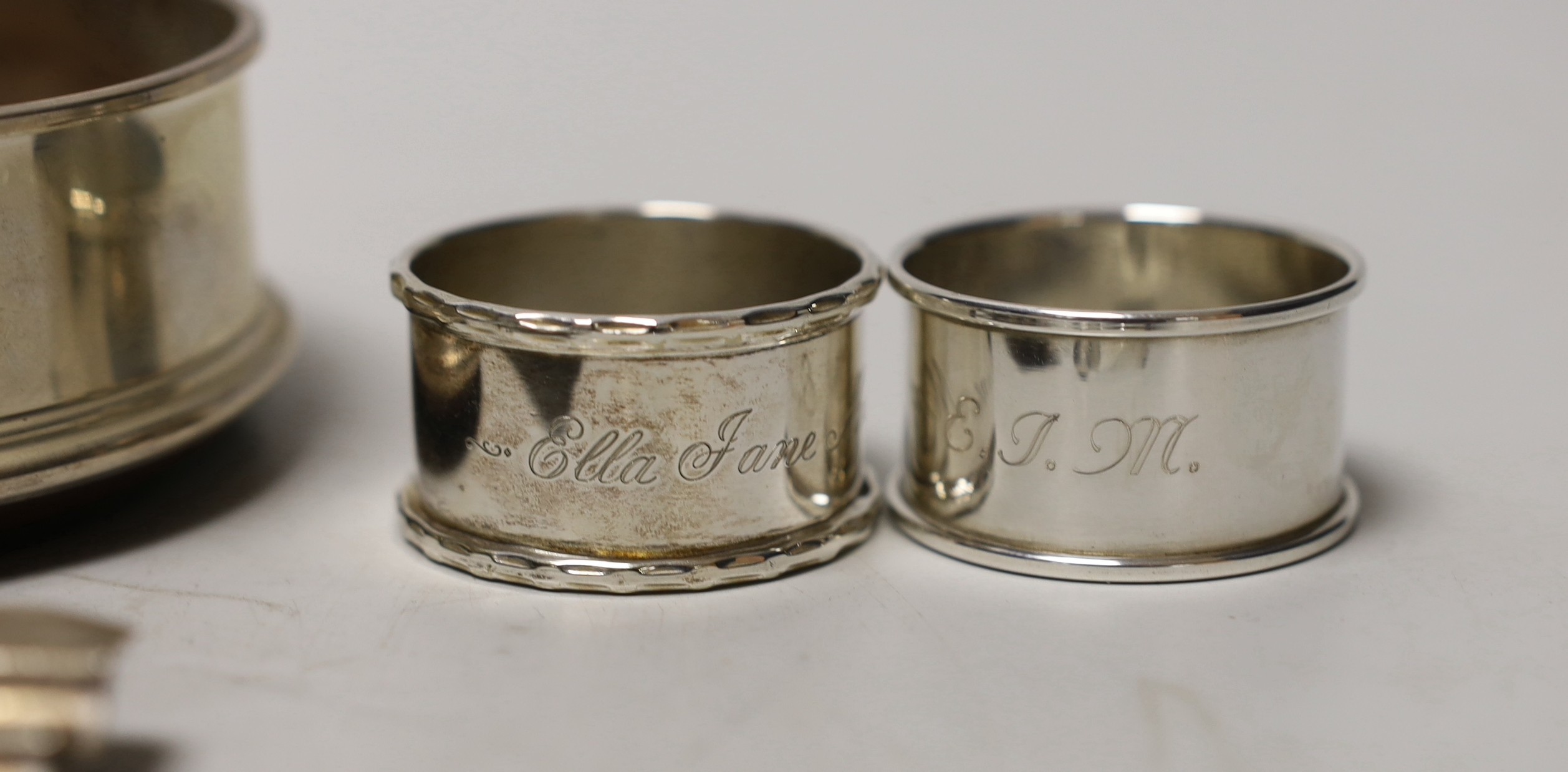 A silver coaster, ashtray, two napkin rings, cutlery etc.